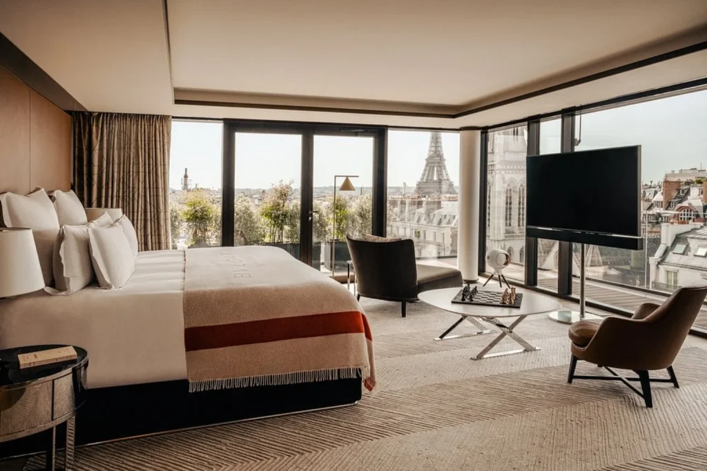 Luxury suite with floor-to-ceiling windows and Eiffel Tower view at Bulgari Hotel Paris