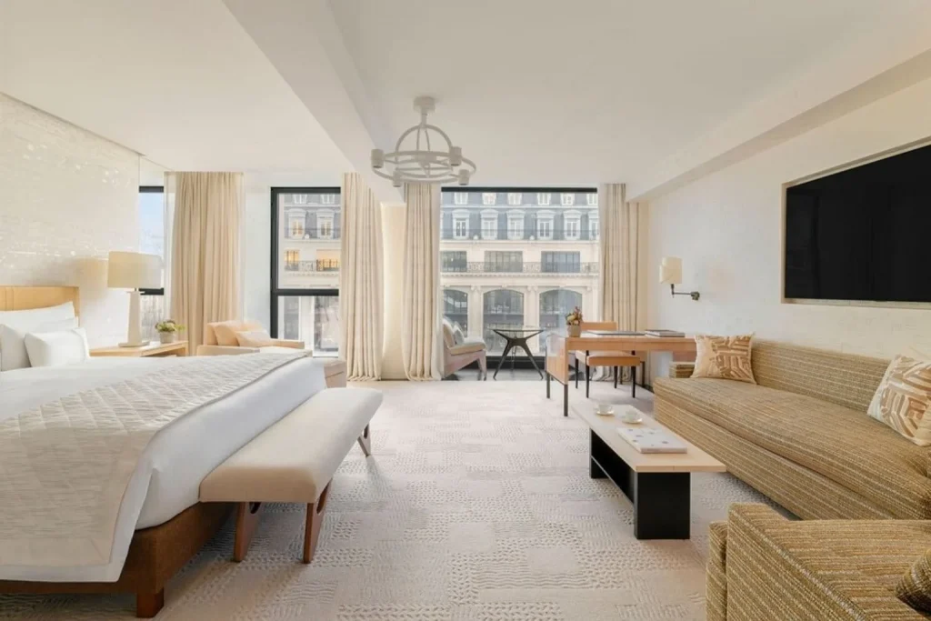 Spacious luxury suite with elegant contemporary décor and city views at Cheval Blanc Paris