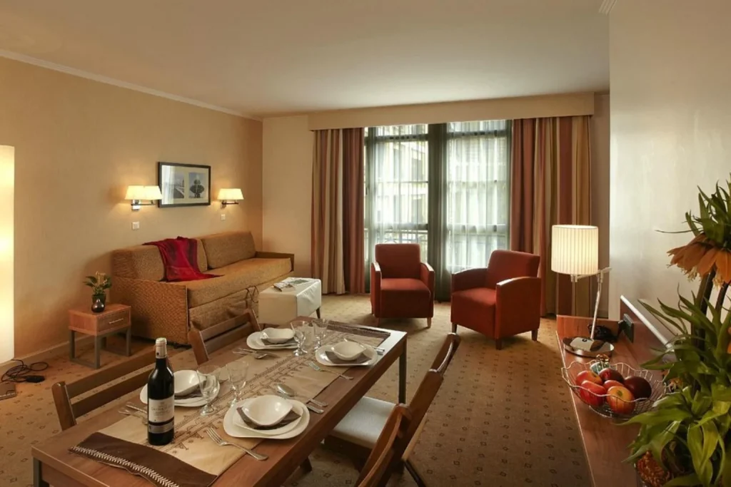 Spacious apartment with dining and living areas at Citadines Saint-Germain-des-Prés Paris