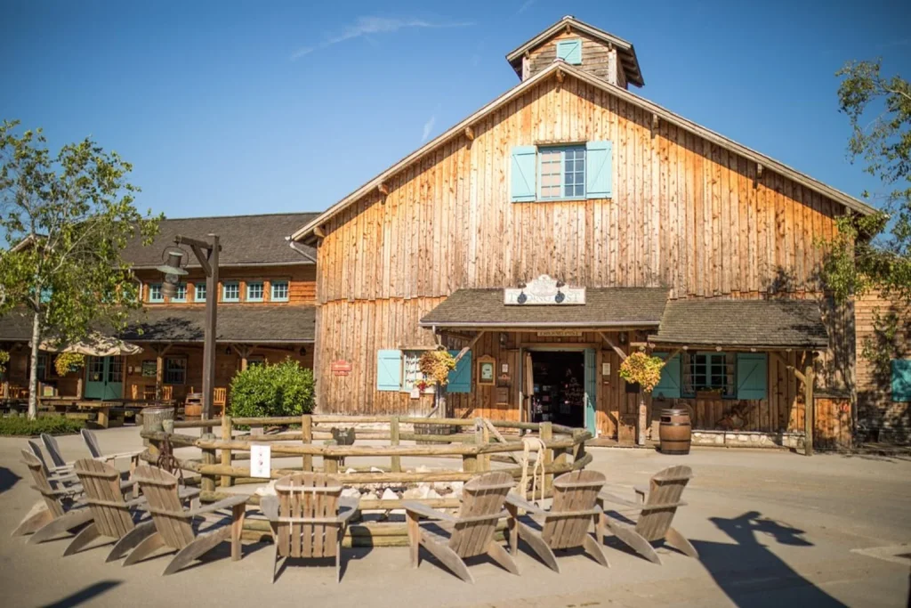 Rustic wooden ranch building and outdoor seating area at Disney Davy Crockett Ranch near Disneyland Paris.
