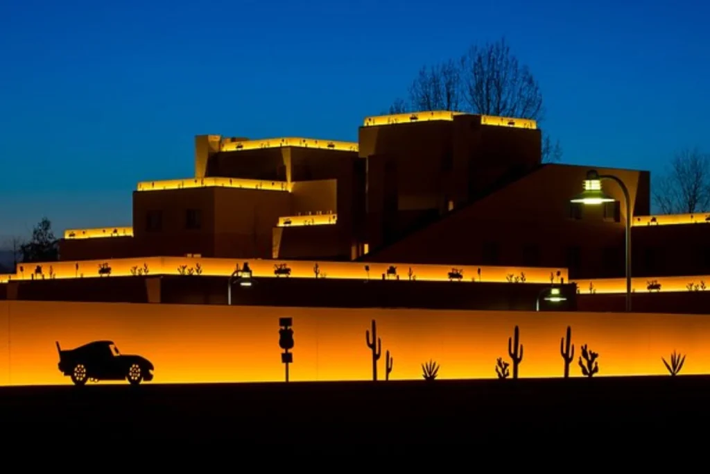Illuminated Route 66 and desert-themed exterior at Disney Hotel Santa Fe, Disneyland Paris.