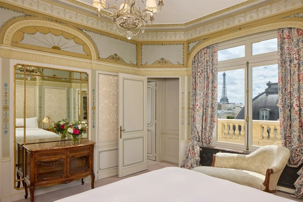 Elegant luxury hotel room with classic French décor and Eiffel Tower view in Paris