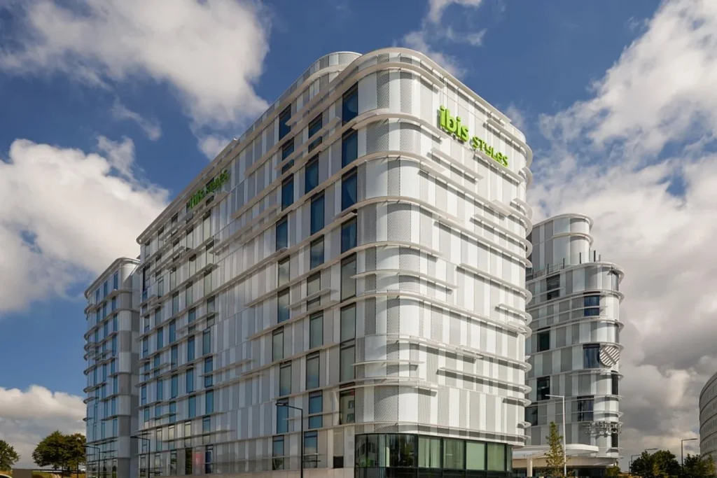 Exterior with modern architecture under a blue sky at Ibis Styles Paris Charles de Gaulle Airport