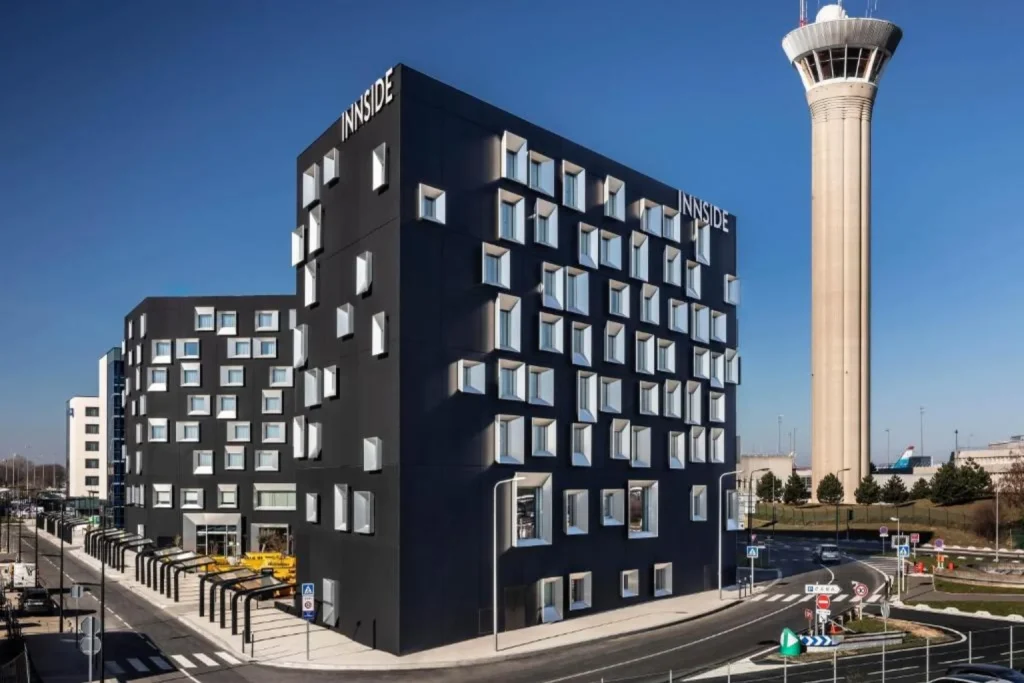 Exterior of INNSiDE by Meliá Paris Charles de Gaulle Airport hotel near the airport control tower