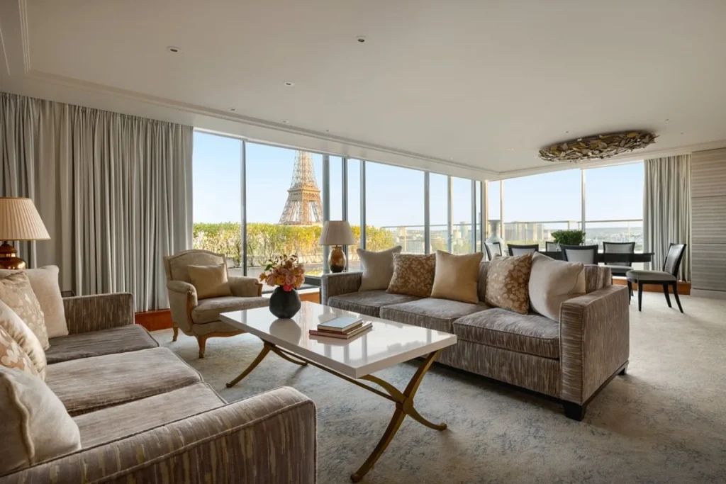 Luxury suite living room with floor-to-ceiling windows and Eiffel Tower view at Shangri-La Paris