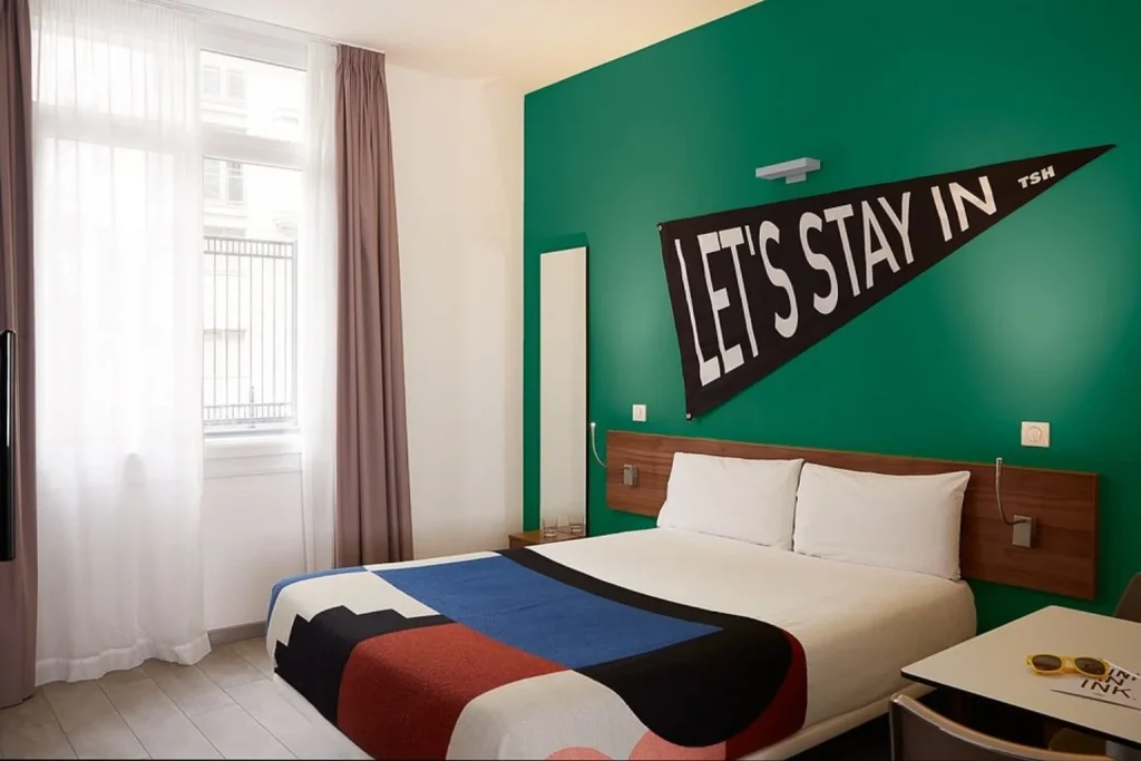 Modern double room with colorful décor at The Social Hub Paris La Défense